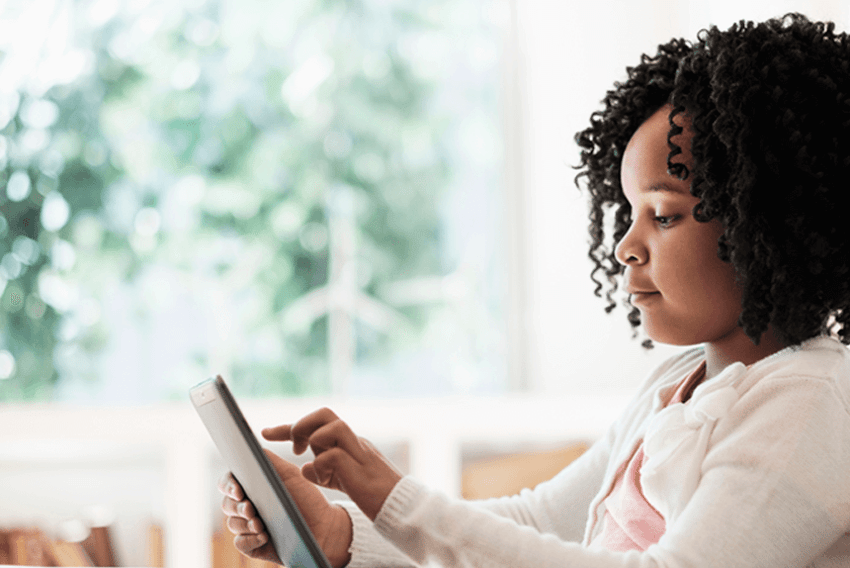 Video in Education young girl using a tablet at home